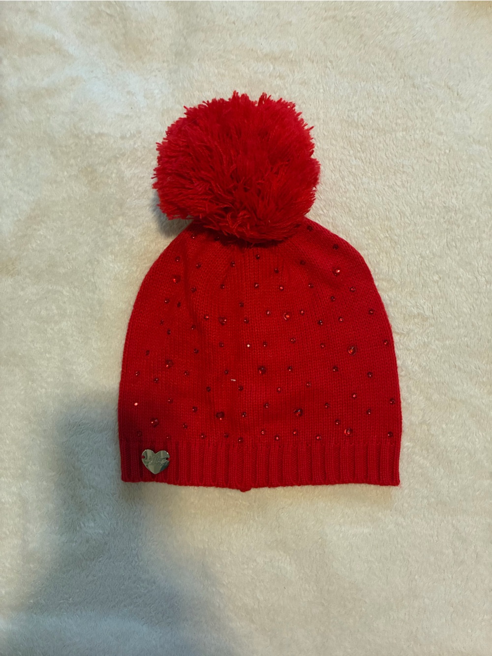 Womenโs Red Pom Knit Beanie with Accent Studs